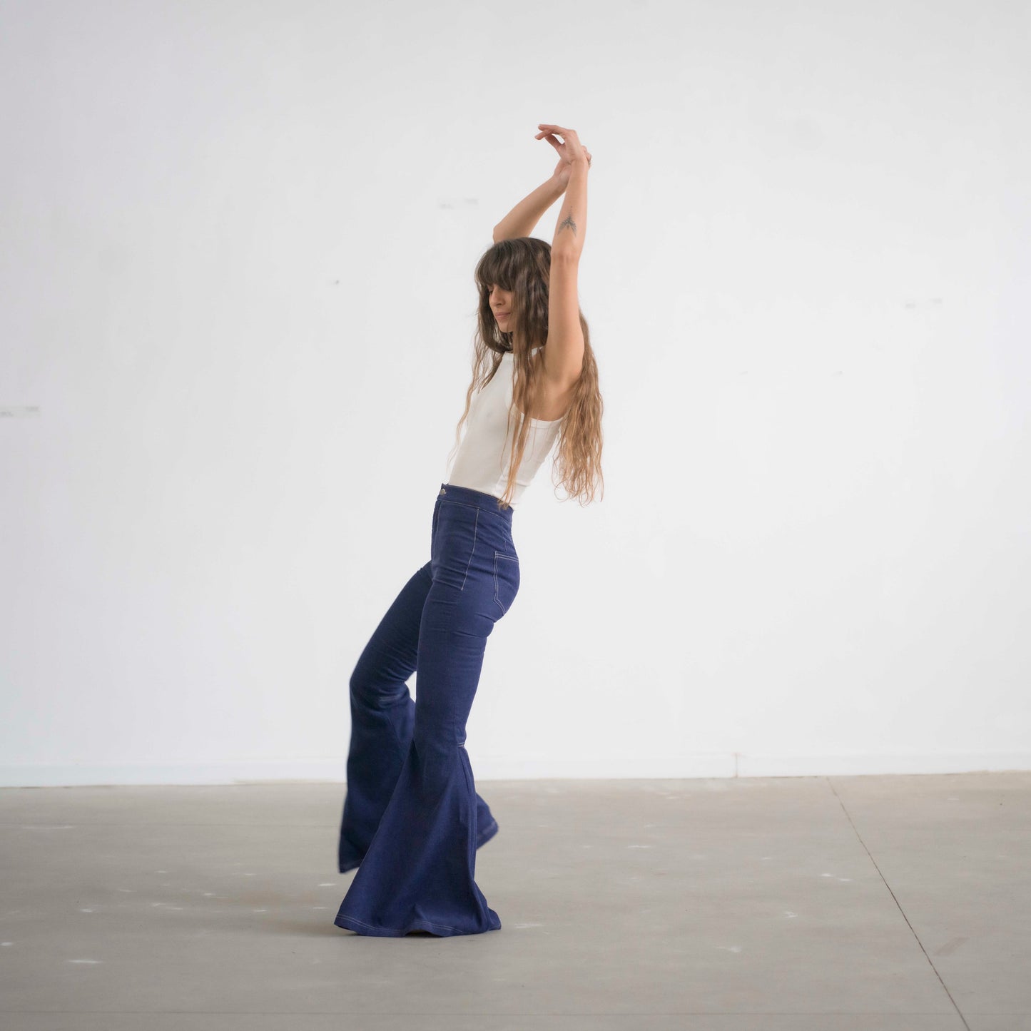 SIMIS The Holly Cord Flares in Indigo – a pair of deep indigo corduroy flare pants, featuring a flattering high-waist fit and leg-lengthening silhouette.