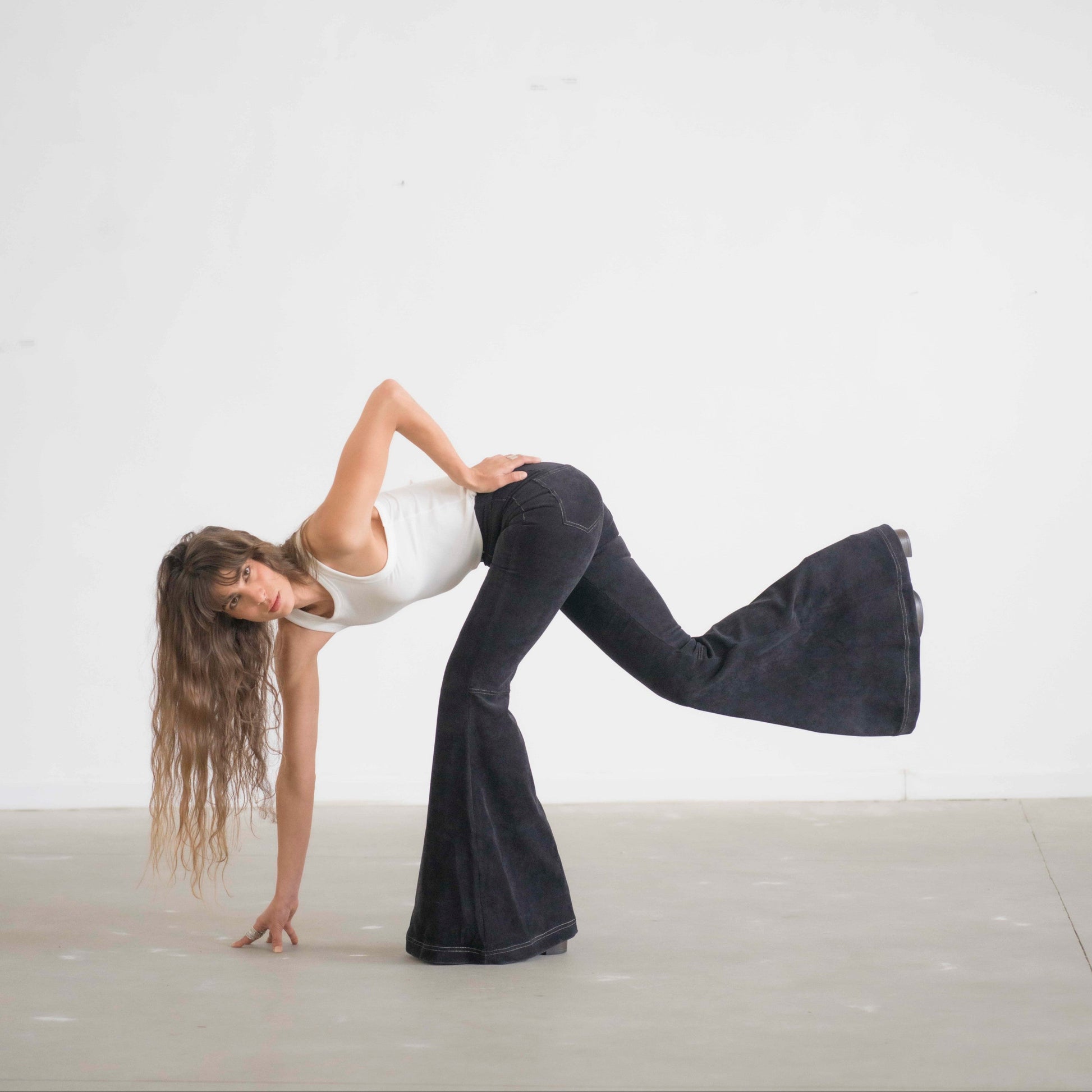 SIMIS The Holly Cord Flares in Black – timeless black corduroy bell-bottom pants with a high waist and flowy flare for an effortlessly elegant silhouette.