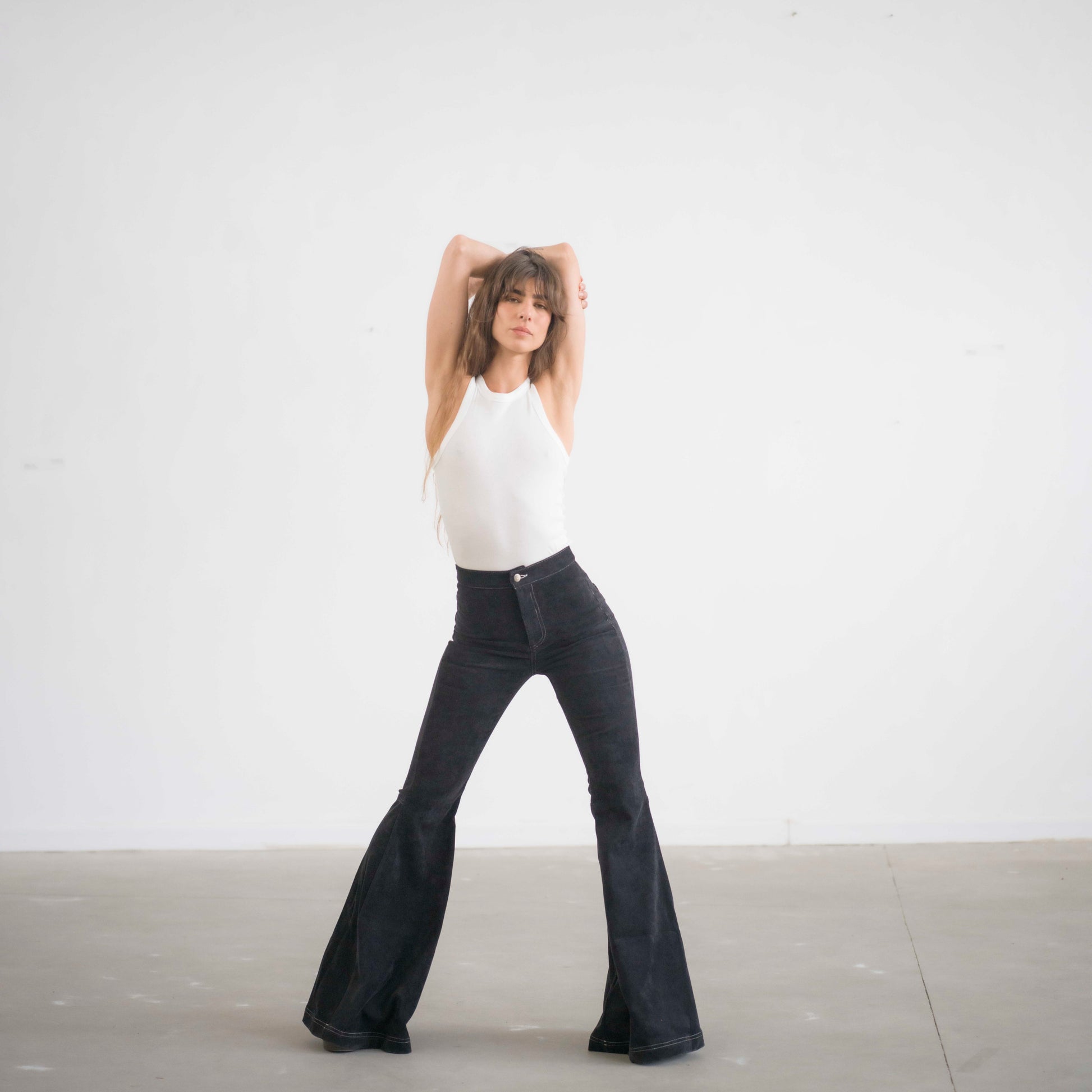 SIMIS The Holly Cord Flares in Black – timeless black corduroy bell-bottom pants with a high waist and flowy flare for an effortlessly elegant silhouette.