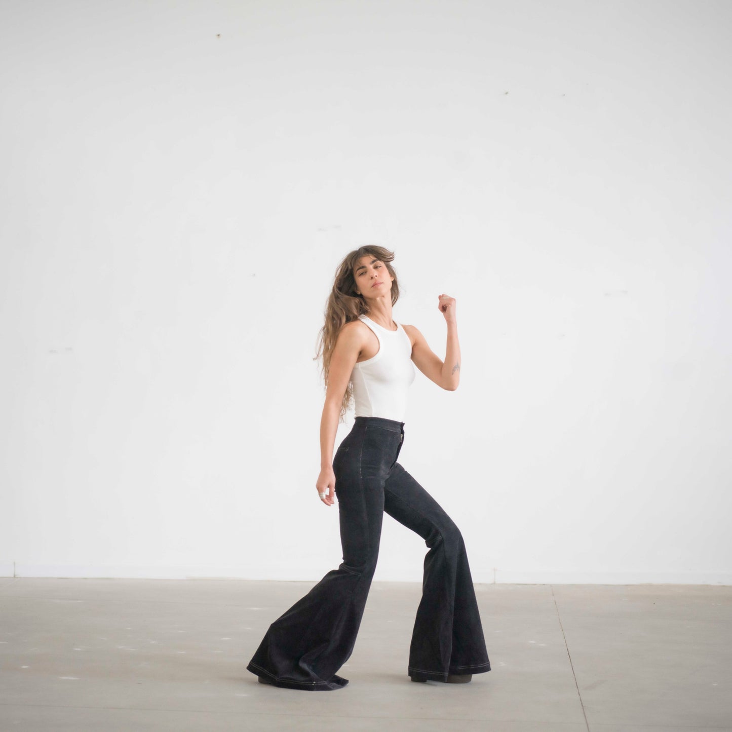 SIMIS The Holly Cord Flares in Black – timeless black corduroy bell-bottom pants with a high waist and flowy flare for an effortlessly elegant silhouette.