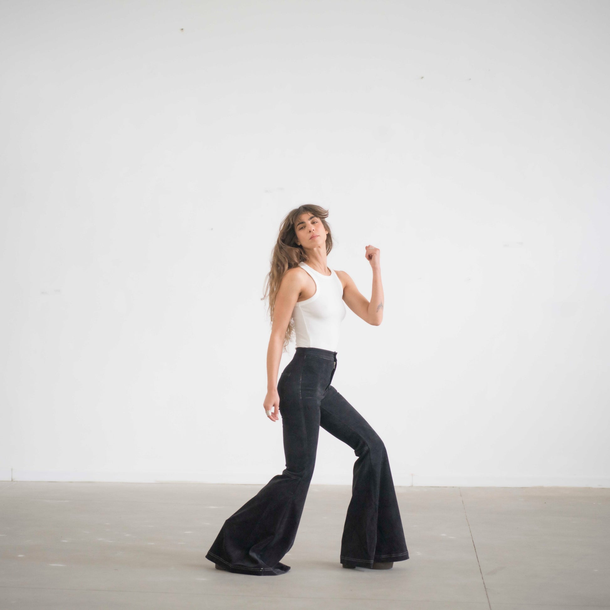 SIMIS The Holly Cord Flares in Black – timeless black corduroy bell-bottom pants with a high waist and flowy flare for an effortlessly elegant silhouette.