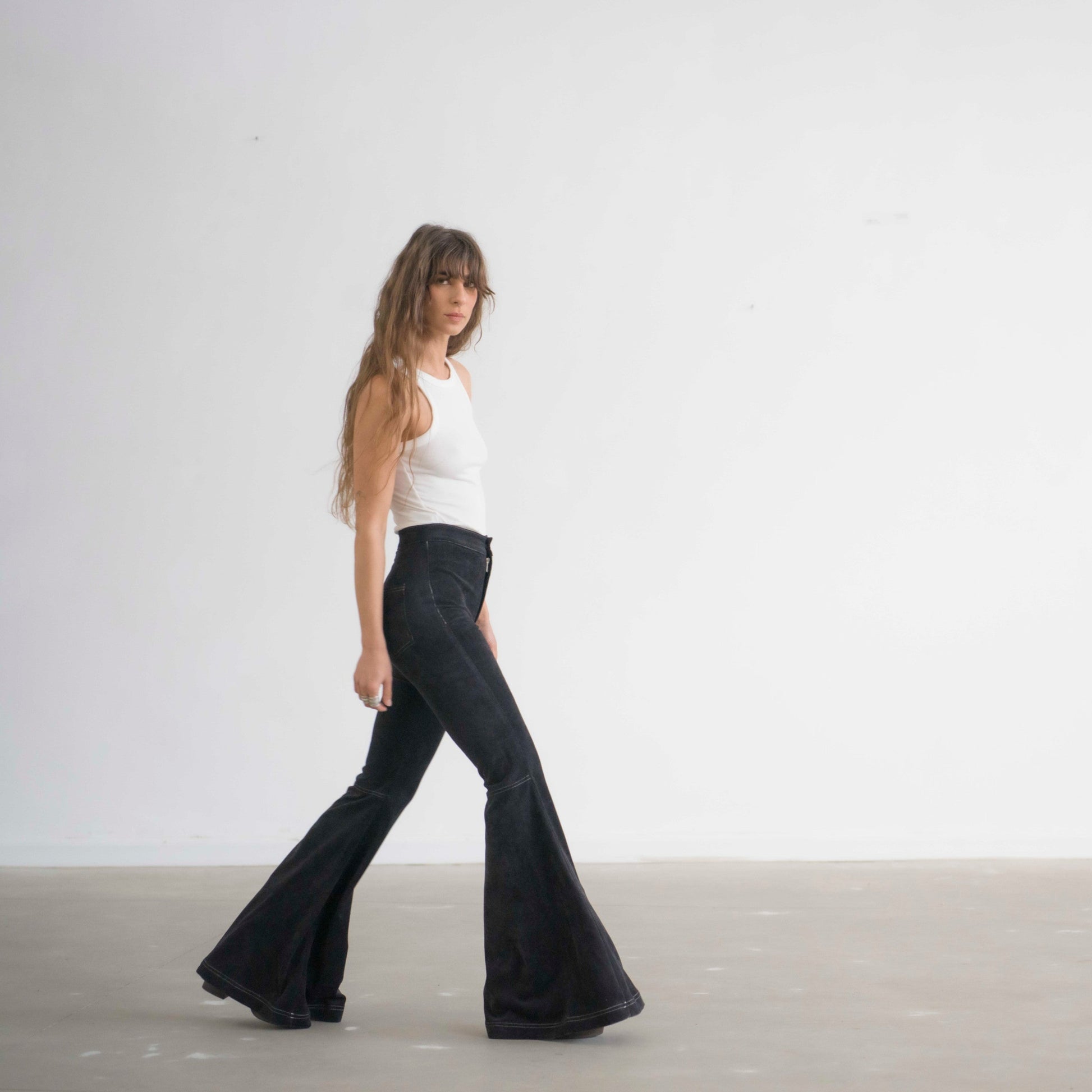 SIMIS The Holly Cord Flares in Black – timeless black corduroy bell-bottom pants with a high waist and flowy flare for an effortlessly elegant silhouette.