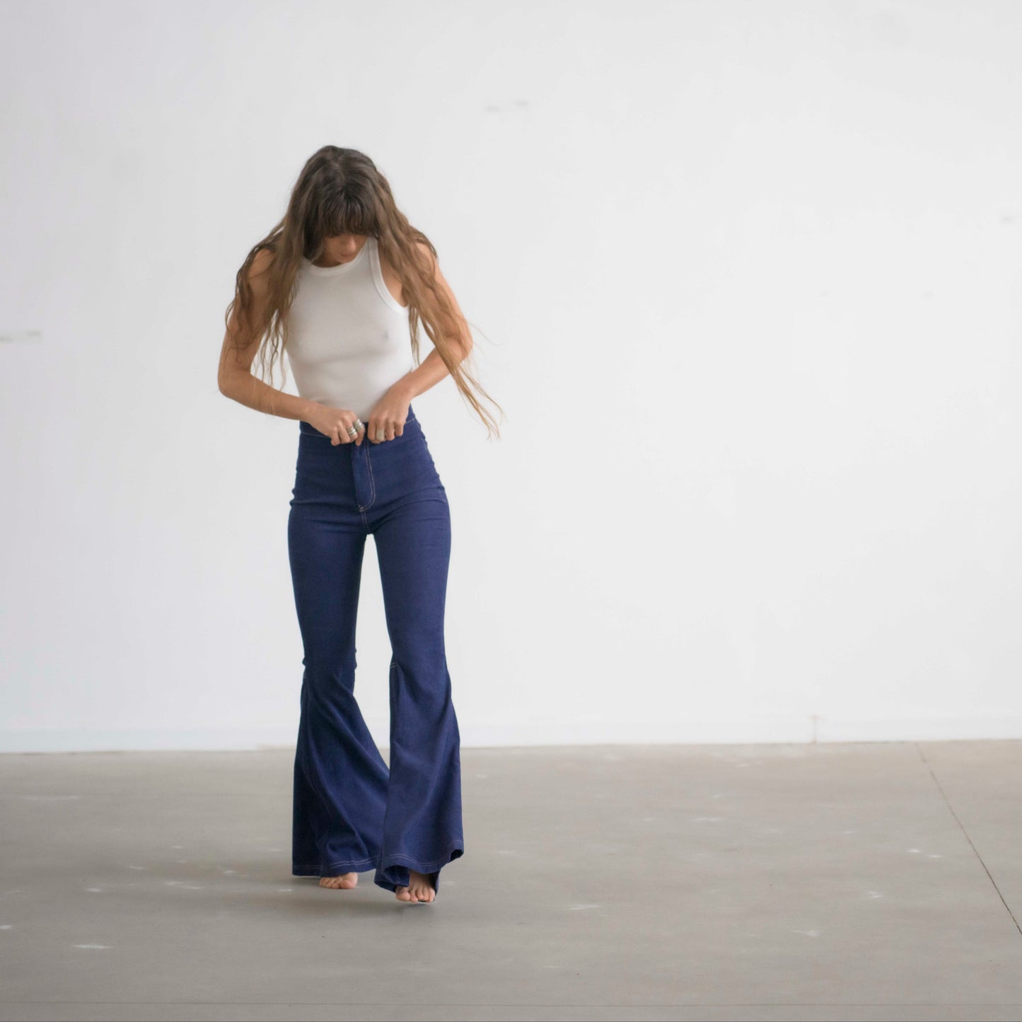SIMIS The Holly Cord Flares in Indigo – a pair of deep indigo corduroy flare pants, featuring a flattering high-waist fit and leg-lengthening silhouette.
