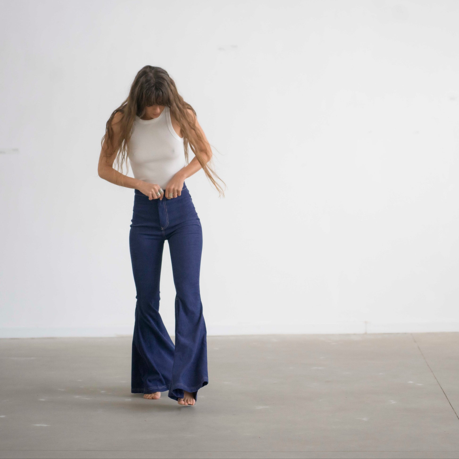 SIMIS The Holly Cord Flares in Indigo – a pair of deep indigo corduroy flare pants, featuring a flattering high-waist fit and leg-lengthening silhouette.