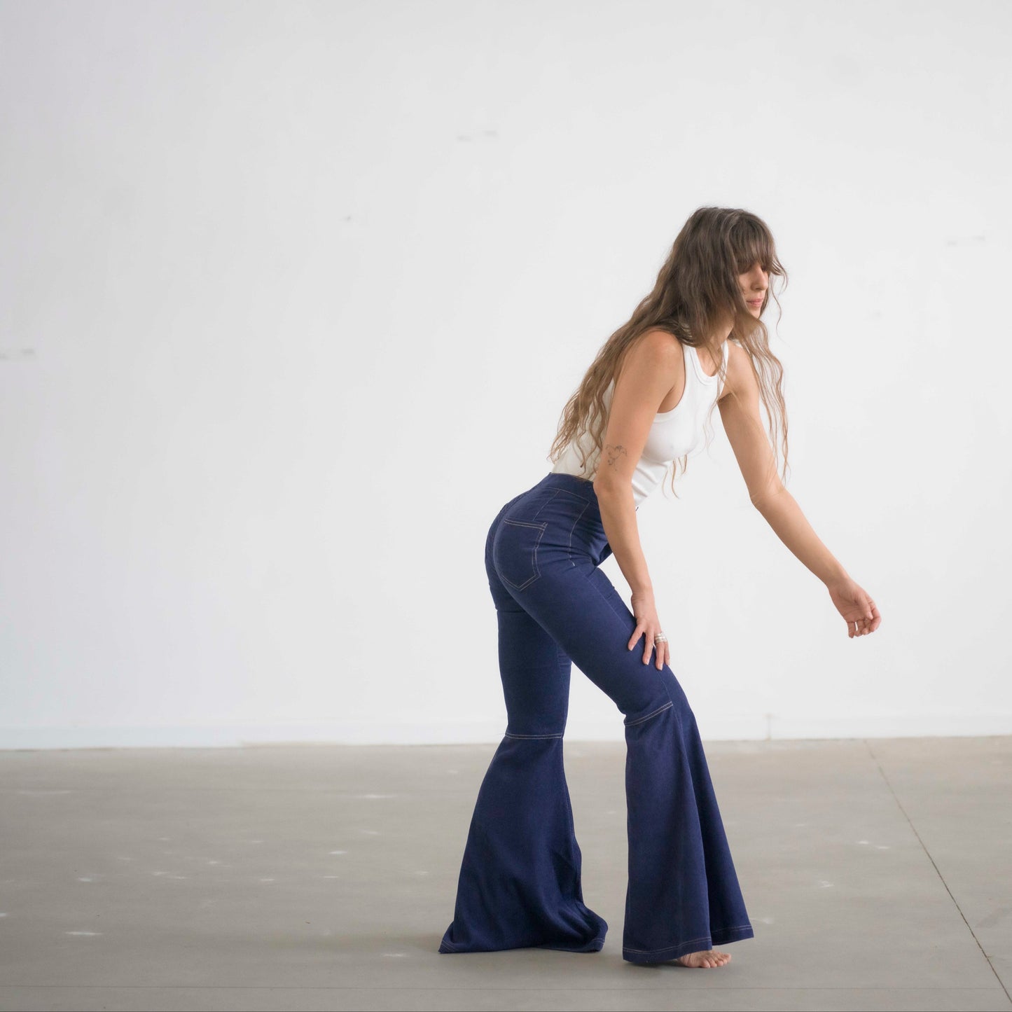 SIMIS The Holly Cord Flares in Indigo – a pair of deep indigo corduroy flare pants, featuring a flattering high-waist fit and leg-lengthening silhouette.