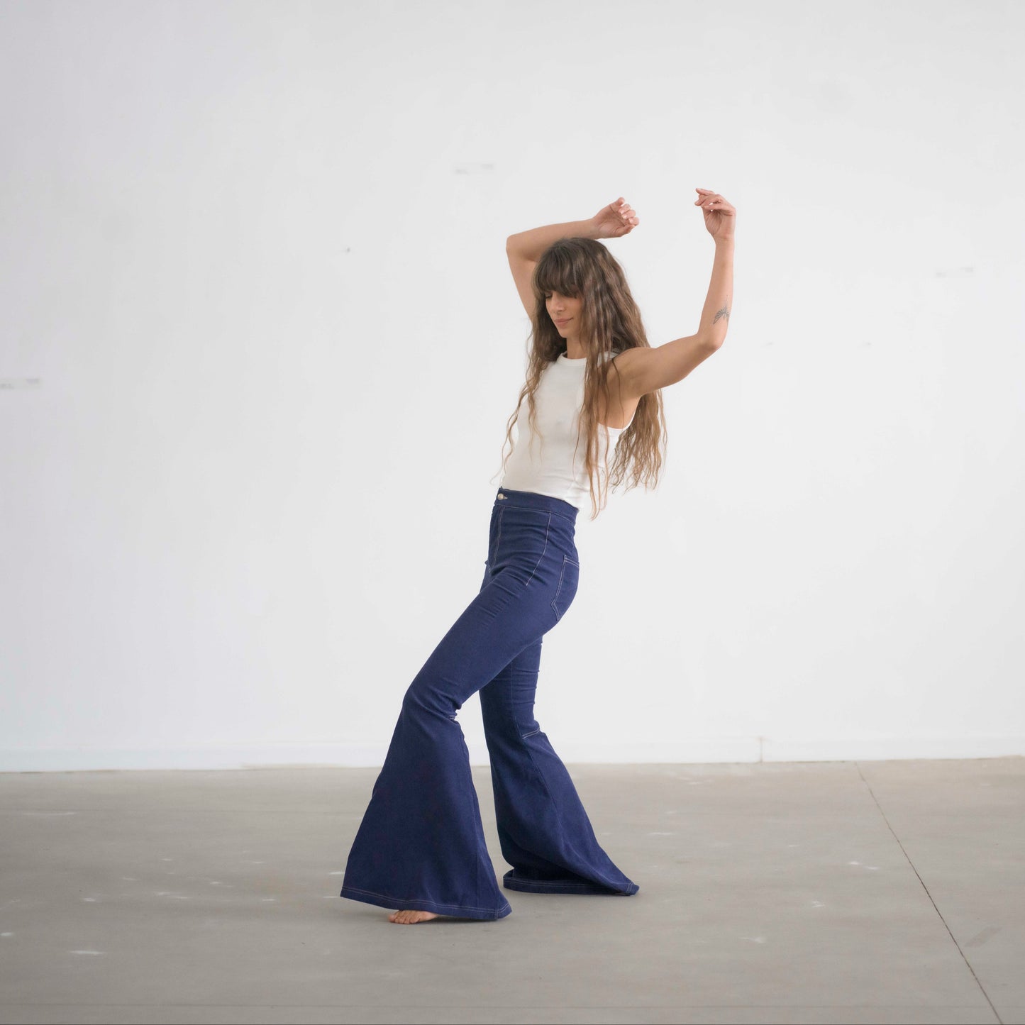 SIMIS The Holly Cord Flares in Indigo – a pair of deep indigo corduroy flare pants, featuring a flattering high-waist fit and leg-lengthening silhouette.