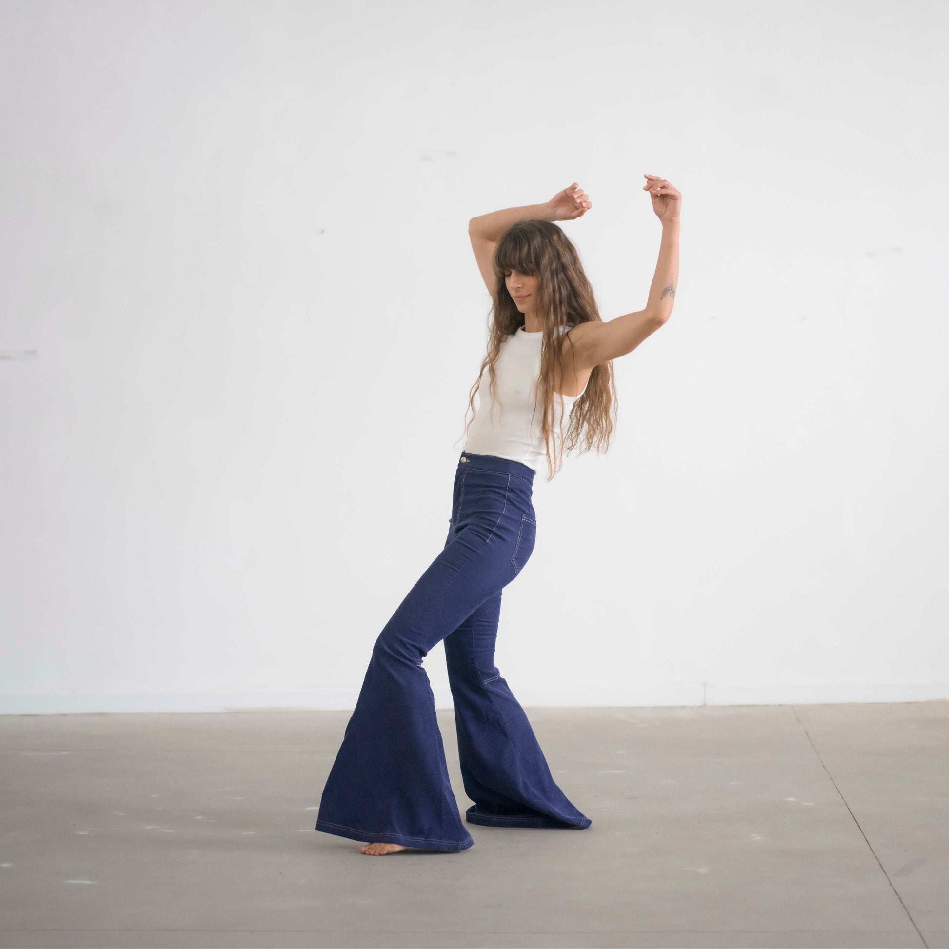 SIMIS The Holly Cord Flares in Indigo – a pair of deep indigo corduroy flare pants, featuring a flattering high-waist fit and leg-lengthening silhouette.