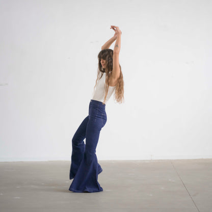 SIMIS The Holly Cord Flares in Indigo – a pair of deep indigo corduroy flare pants, featuring a flattering high-waist fit and leg-lengthening silhouette.