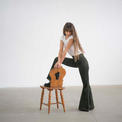SIMIS The Holly Cord Flares in Olive – trendy olive-green corduroy bell-bottom pants with a structured waist and flowing flare for a relaxed yet refined look.